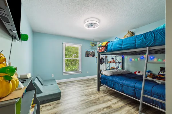 a kitchen with stainless steel appliances granite countertop a sink dishwasher and cabinets with wooden floor