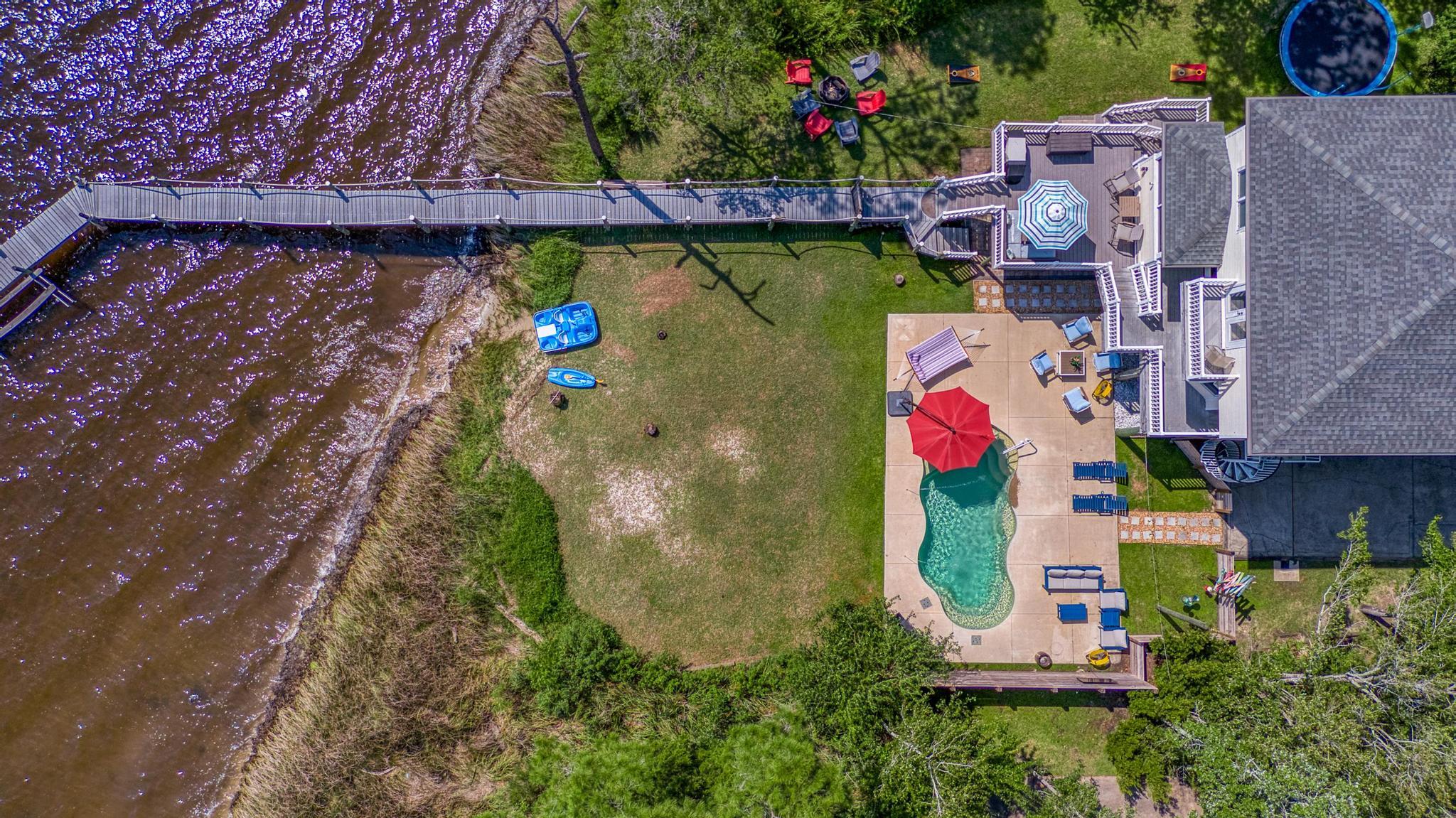 7121 Wells Avenue Navarre, FL 32566 - Photo 123 of 125 an aerial view of residential house with outdoor space and swimming pool