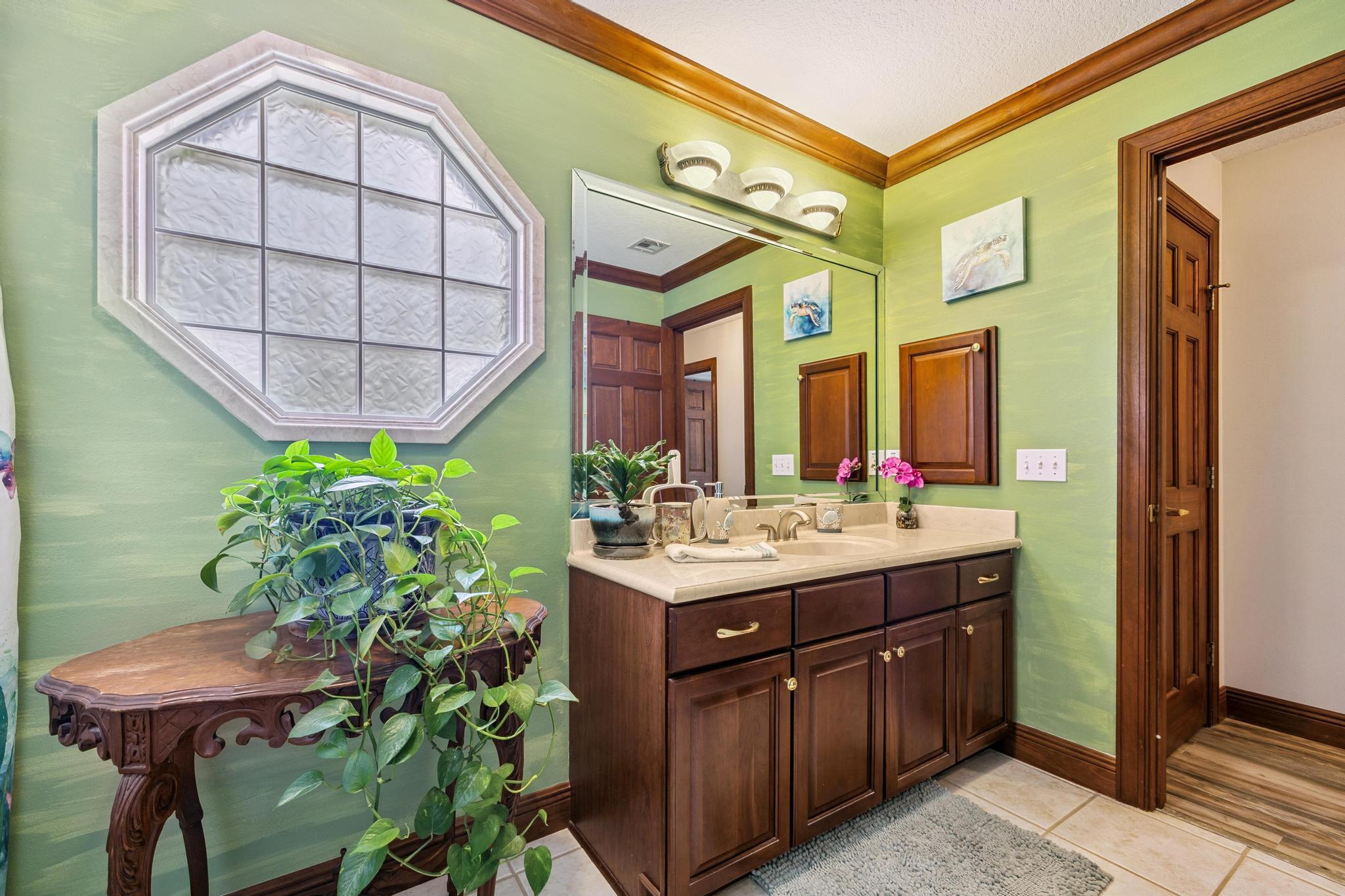 7121 Wells Avenue Navarre, FL 32566 - Photo 17 of 125 a bathroom with a granite countertop sink and a mirror