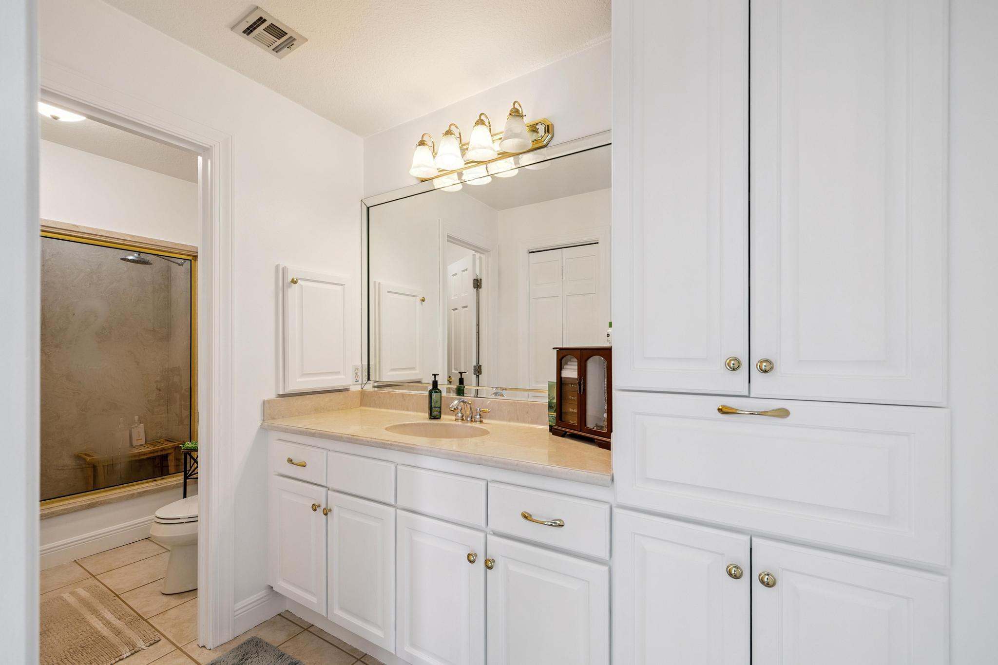 7121 Wells Avenue Navarre, FL 32566 - Photo 24 of 125 a bathroom with a sink double vanity granite and shower
