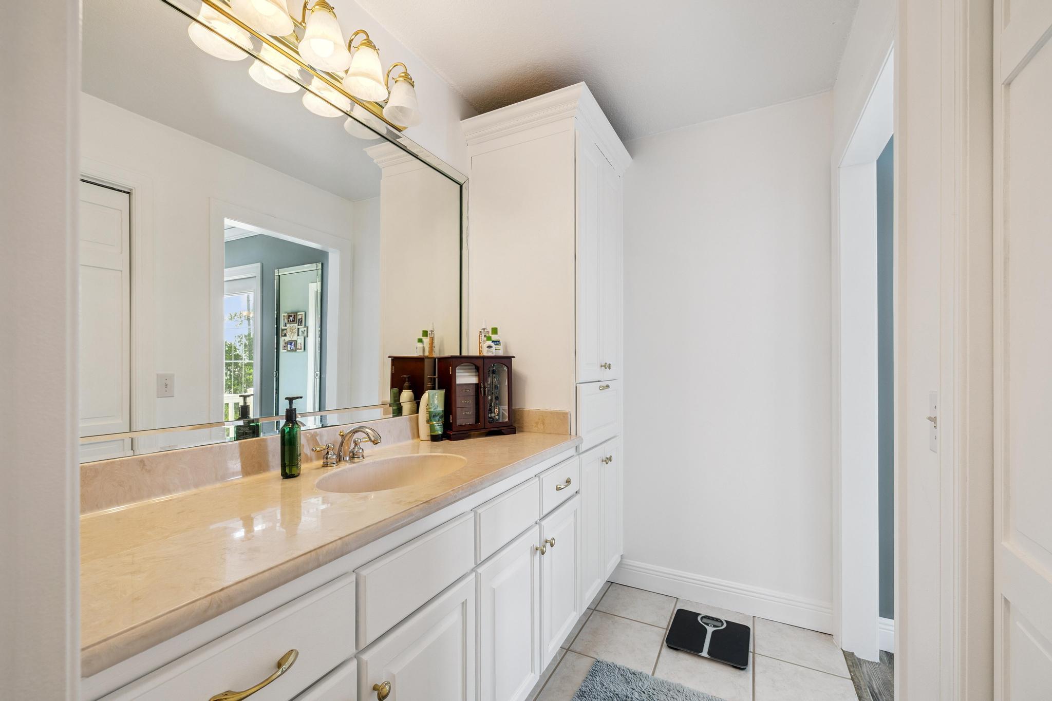 7121 Wells Avenue Navarre, FL 32566 - Photo 25 of 125 a bathroom with a sink and a mirror
