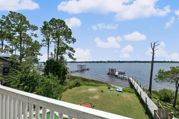 a view of a house with garden and a park