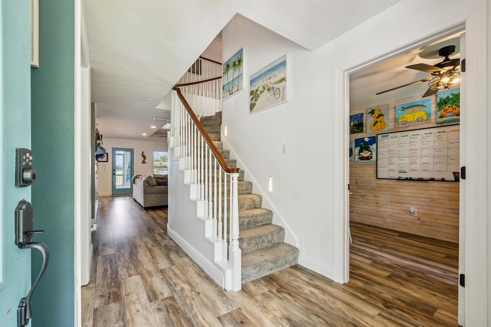 7121 Wells Avenue Navarre, FL 32566 - Photo 30 of 125 a view of entryway and hall with wooden floor