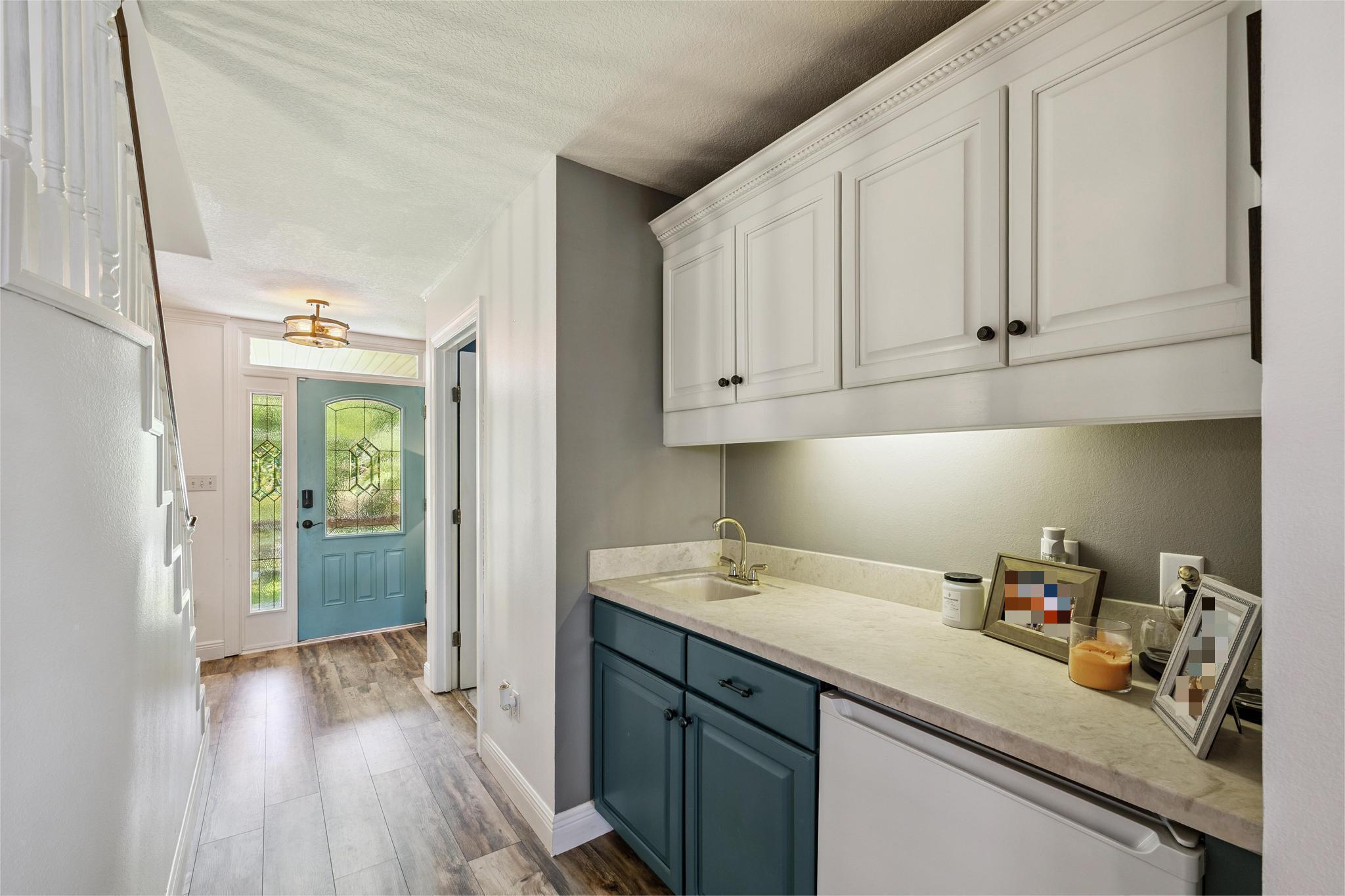 7121 Wells Avenue Navarre, FL 32566 - Photo 32 of 125 a kitchen with stainless steel appliances granite countertop a sink dishwasher and cabinets with wooden floor