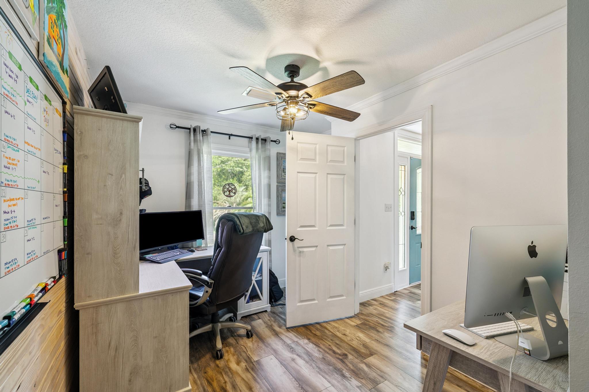 7121 Wells Avenue Navarre, FL 32566 - Photo 34 of 125 a workspace with furniture and a window