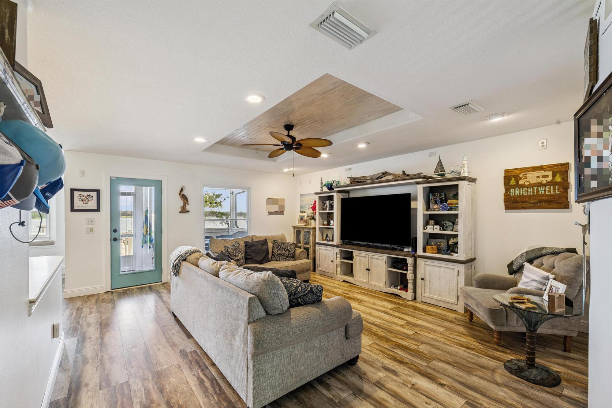 7121 Wells Avenue Navarre, FL 32566 - Photo 35 of 125 a living room with furniture and a flat screen tv