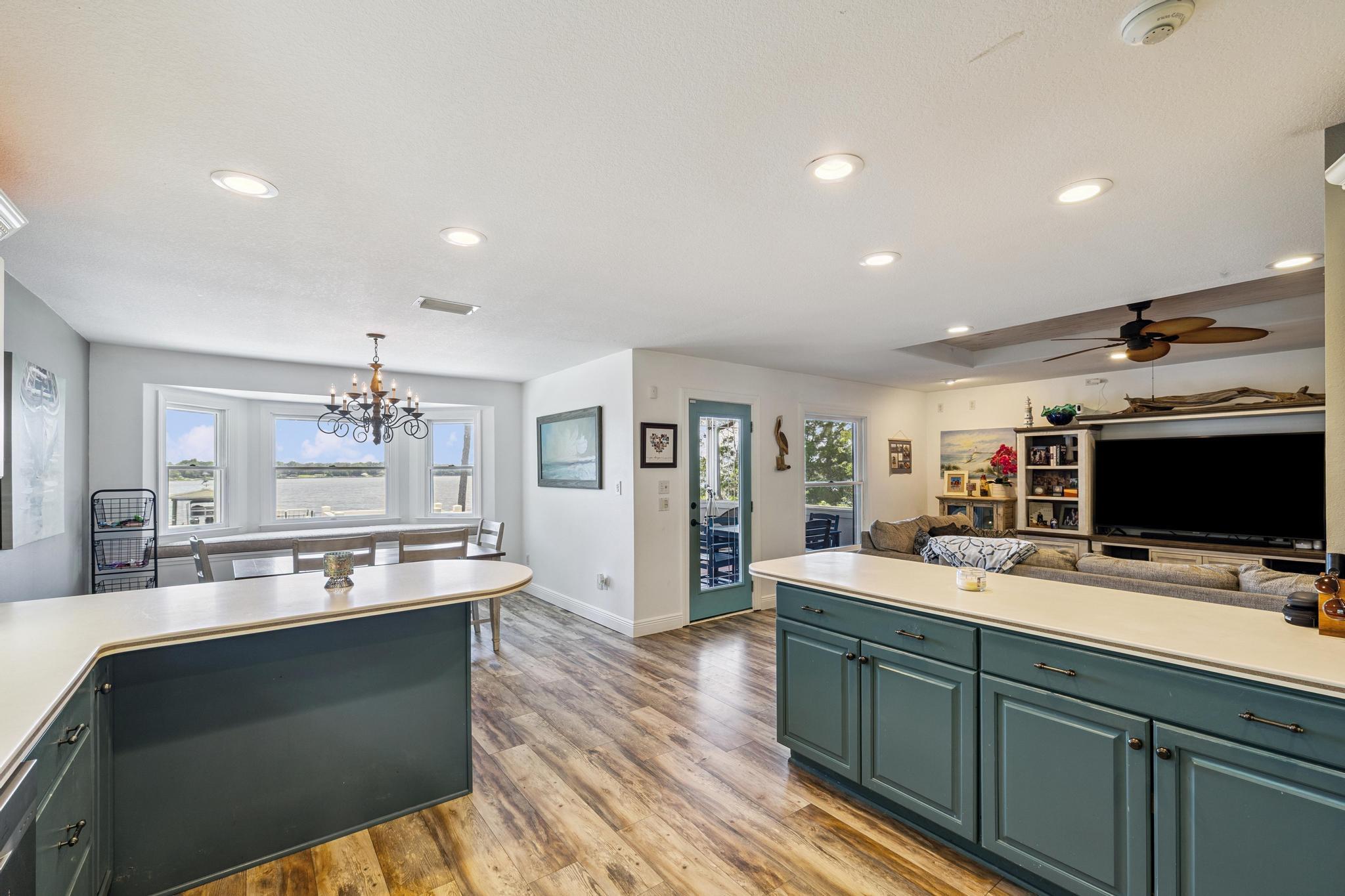7121 Wells Avenue Navarre, FL 32566 - Photo 41 of 125 a large kitchen with a large counter top a sink stainless steel appliances and cabinets