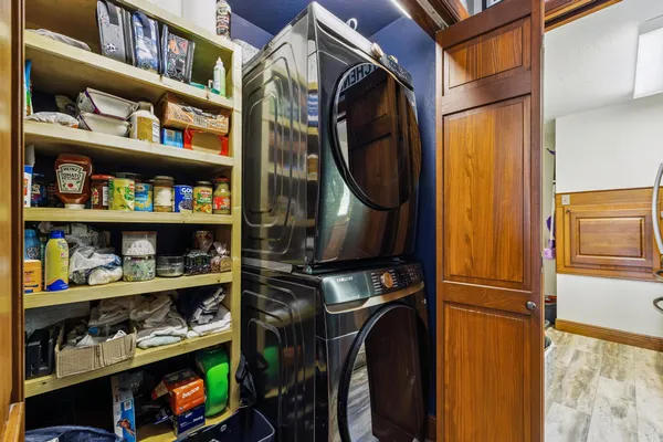 a view of a wooden deck with a yard