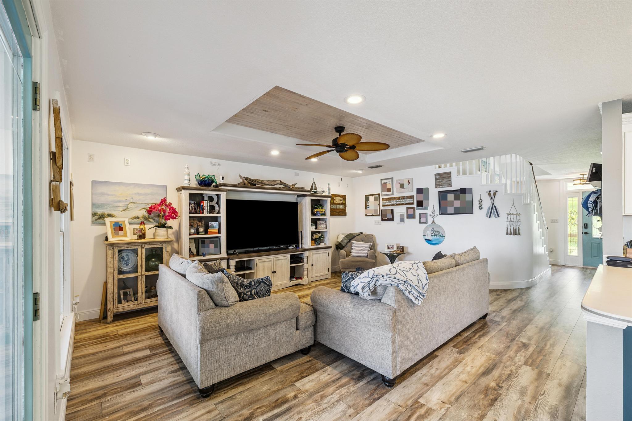 7121 Wells Avenue Navarre, FL 32566 - Photo 48 of 125 a living room with furniture and a flat screen tv