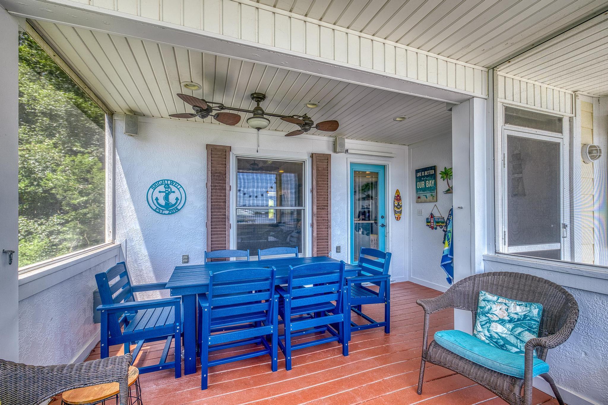 7121 Wells Avenue Navarre, FL 32566 - Photo 52 of 125 a view of a dining room with furniture window and wooden floor