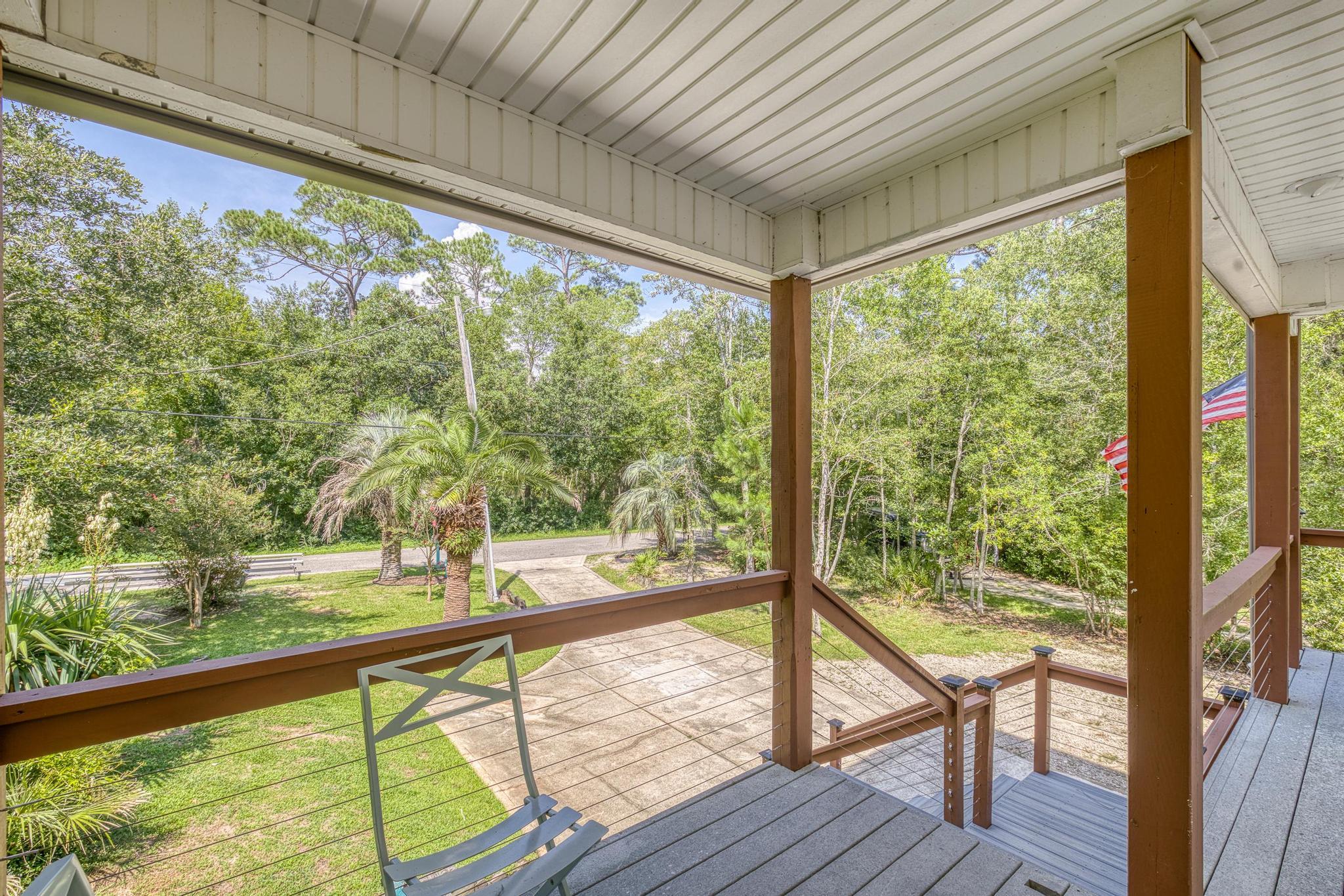 7121 Wells Avenue Navarre, FL 32566 - Photo 63 of 125 a view of balcony with wooden floor