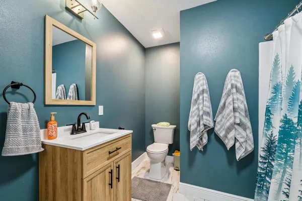 a bathroom with a sink double vanity granite and shower