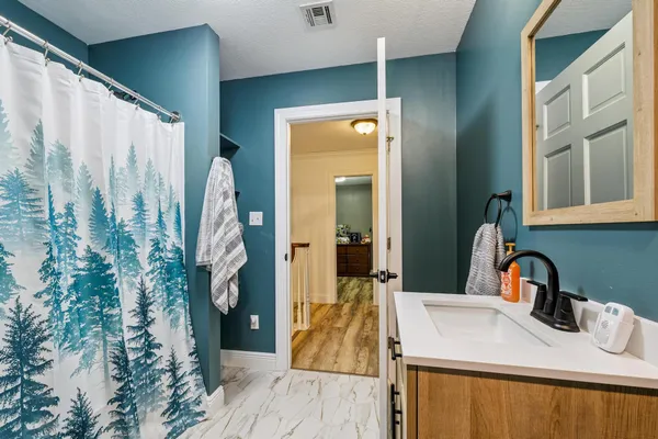 a bathroom with a sink and a mirror