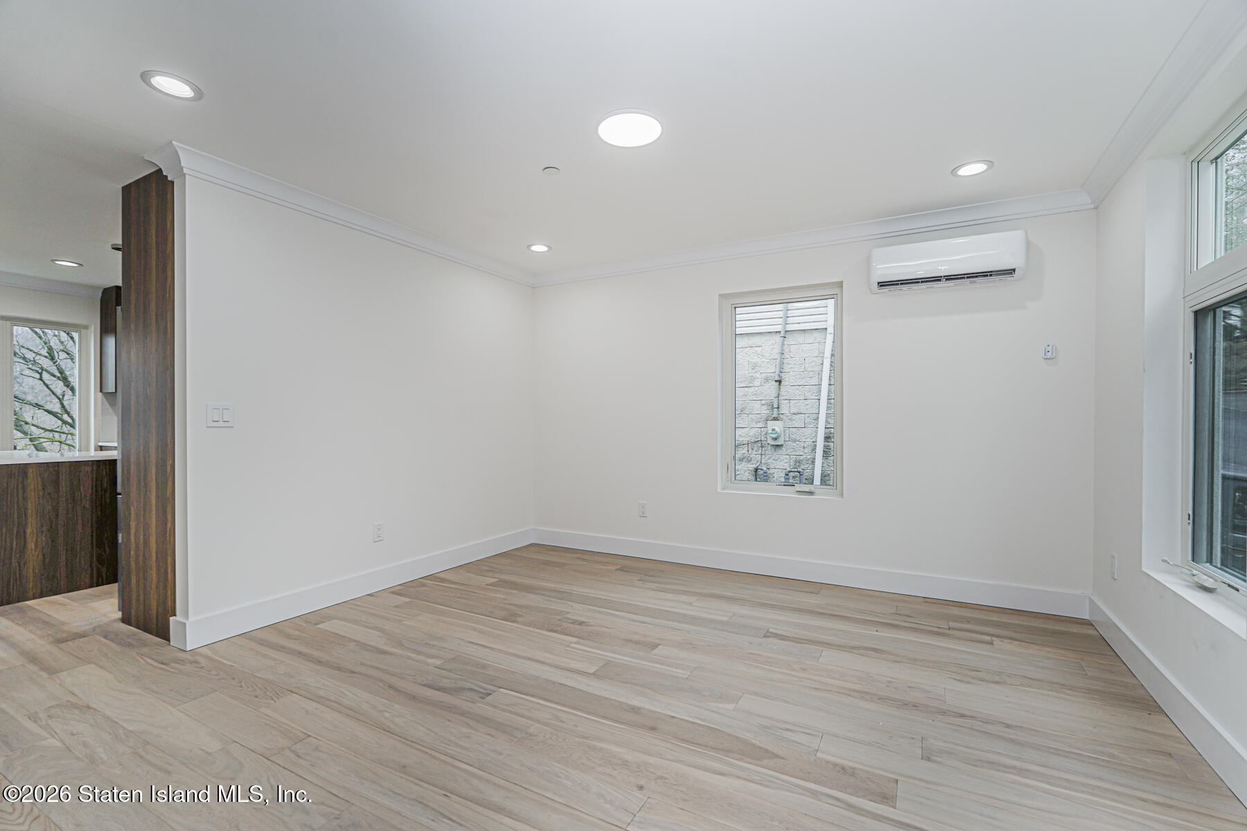 54 Cedarcliff Road Staten Island, NY 10301 - Photo 16 of 49 an empty room with wooden floor and window