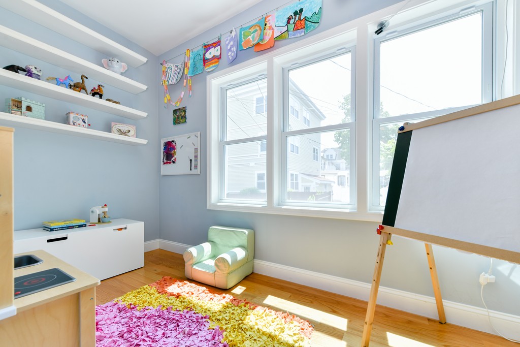 2 Mendell Way, Unit 2 Boston, MA 02130 - Photo 3 of 12 a bedroom with a bed and a window