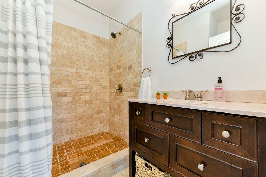 2 Mendell Way, Unit 2 Boston, MA 02130 - Photo 7 of 12 a bathroom with a sink and a mirror