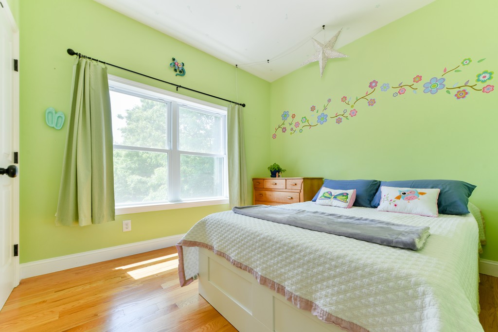 2 Mendell Way, Unit 2 Boston, MA 02130 - Photo 8 of 12 a bedroom with a bed and a window