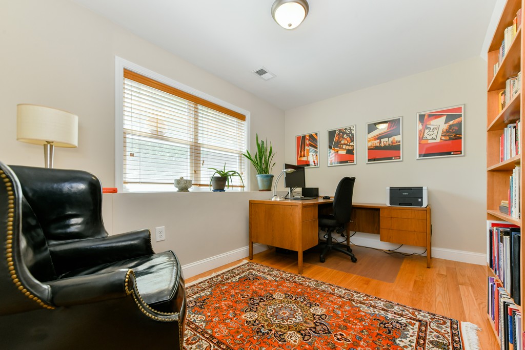 2 Mendell Way, Unit 2 Boston, MA 02130 - Photo 9 of 12 a living room with furniture and a wooden floor