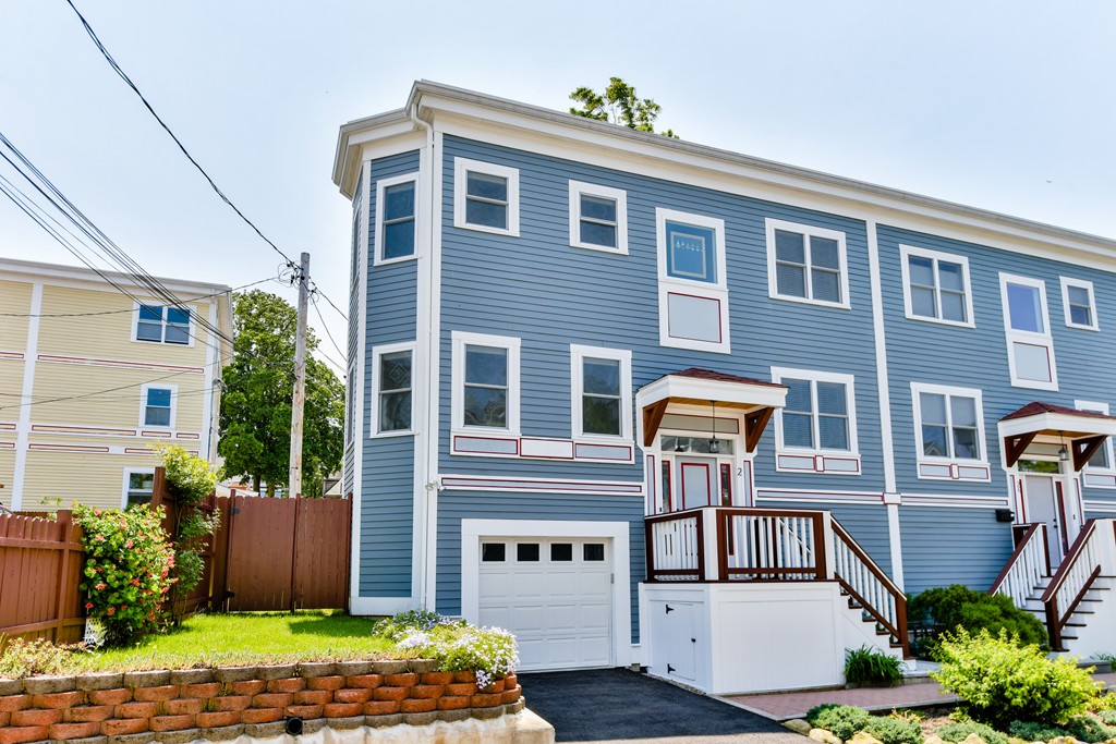 2 Mendell Way, Unit 2 Boston, MA 02130 - Photo 10 of 12 a front view of a house with a yard