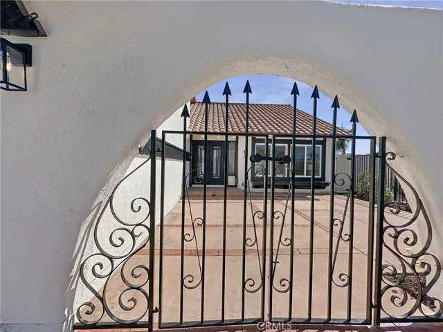 a view of entrance gate with wooden floor