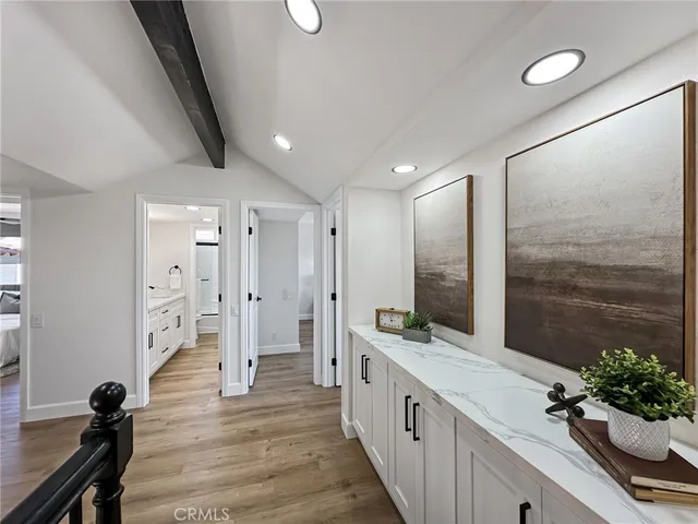 a large bathroom with a double vanity sink a large mirror and a shower