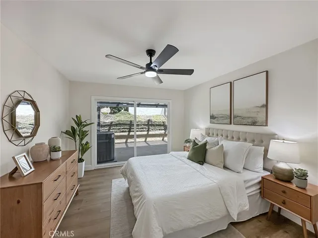 a bedroom with a large bed and a large window