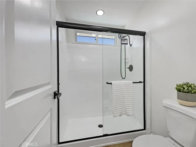 a view of a workspace with furniture and wooden floor