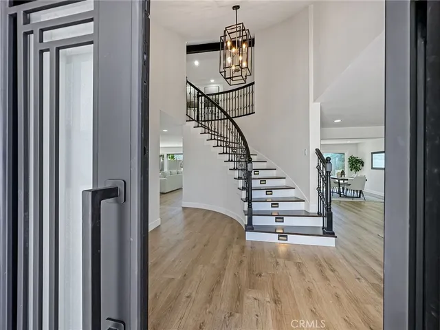 a view of entryway with wooden floor