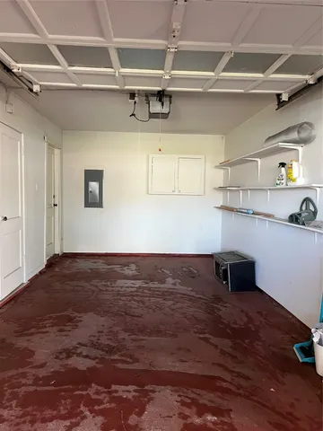 a view of storage and utility room with wooden floor
