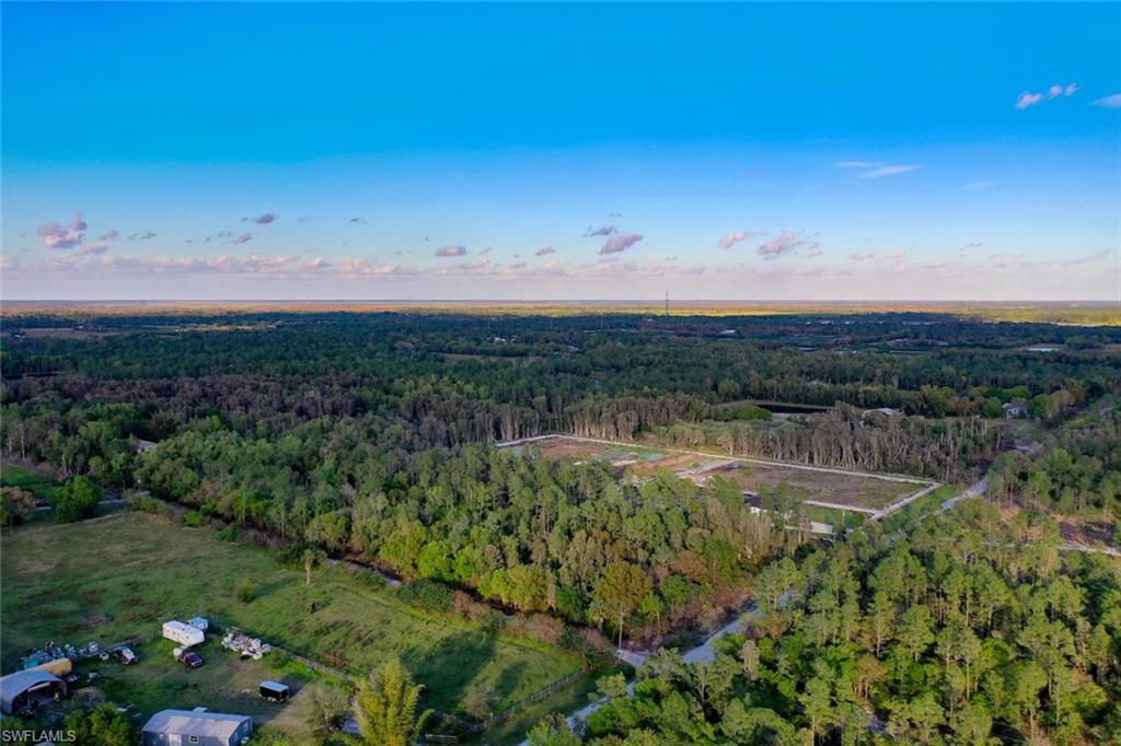 0 Platt Road Naples, FL 34120 - Photo 11 of 16 Aerial overview of property's location with a forest