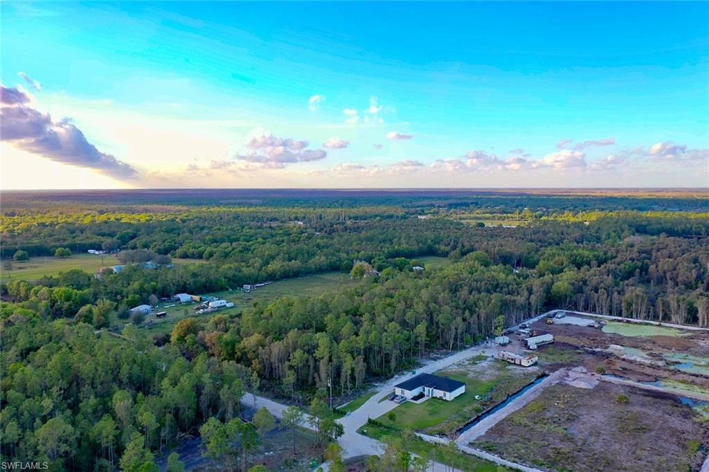 0 Platt Road Naples, FL 34120 - Photo 16 of 16 Aerial overview of property's location featuring a heavily wooded area