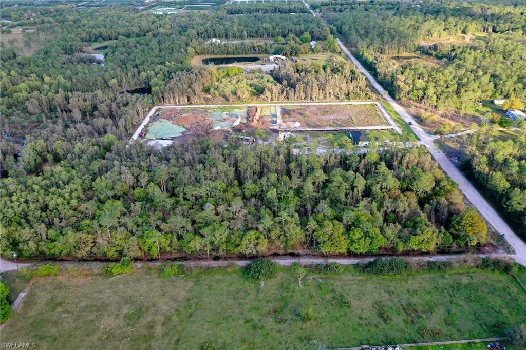 0 Platt Road Naples, FL 34120 - Photo 3 of 16 Aerial overview of property's location with a forest