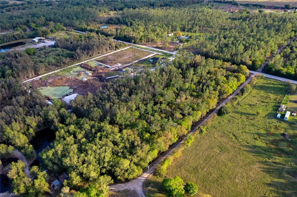 0 Platt Road Naples, FL 34120 - Photo 8 of 16 Aerial overview of property's location with a forest