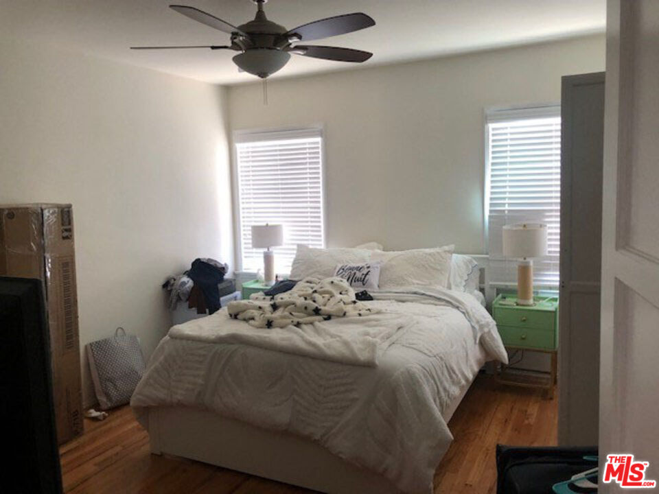 4114 Warner Boulevard Burbank, CA 91505 - Photo 11 of 15 a bed sitting in a bedroom next to a window