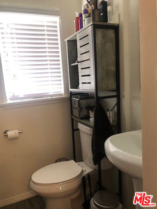 4114 Warner Boulevard Burbank, CA 91505 - Photo 14 of 15 a white toilet sitting next to a bathroom sink