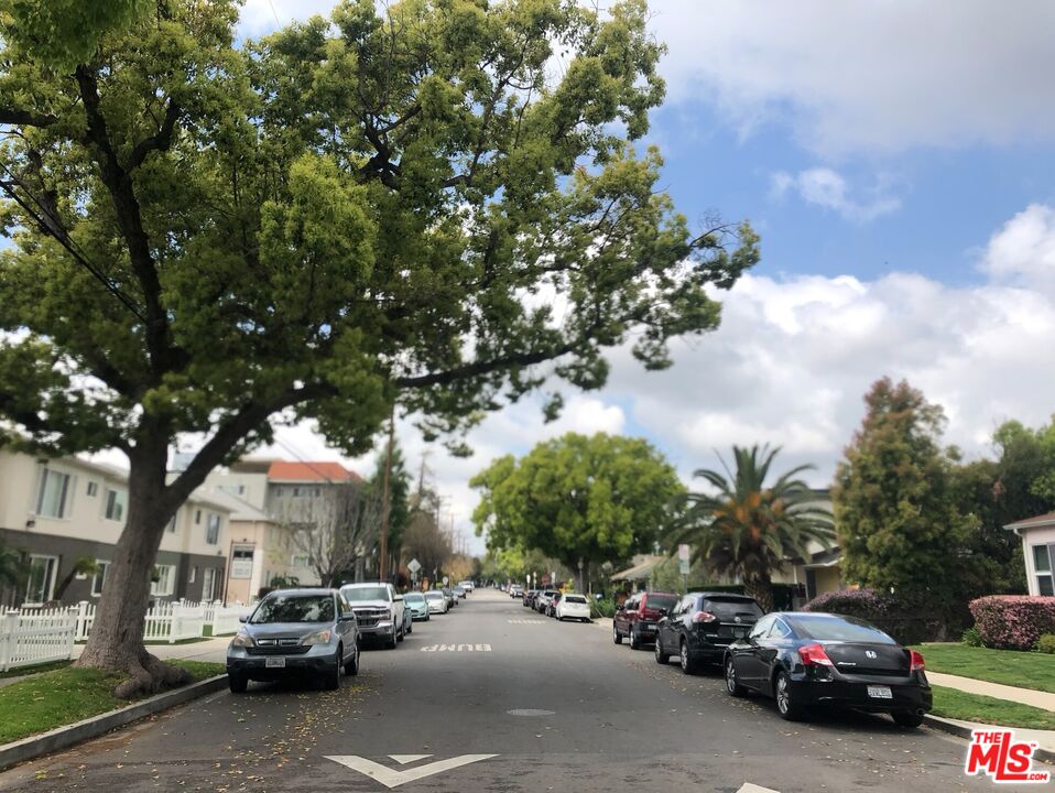 4114 Warner Boulevard Burbank, CA 91505 - Photo 5 of 15 a view of road with card parked on side and retail shops