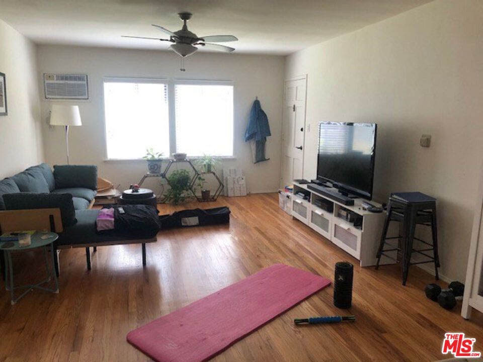 4114 Warner Boulevard Burbank, CA 91505 - Photo 10 of 15 a living room with furniture and a flat screen tv