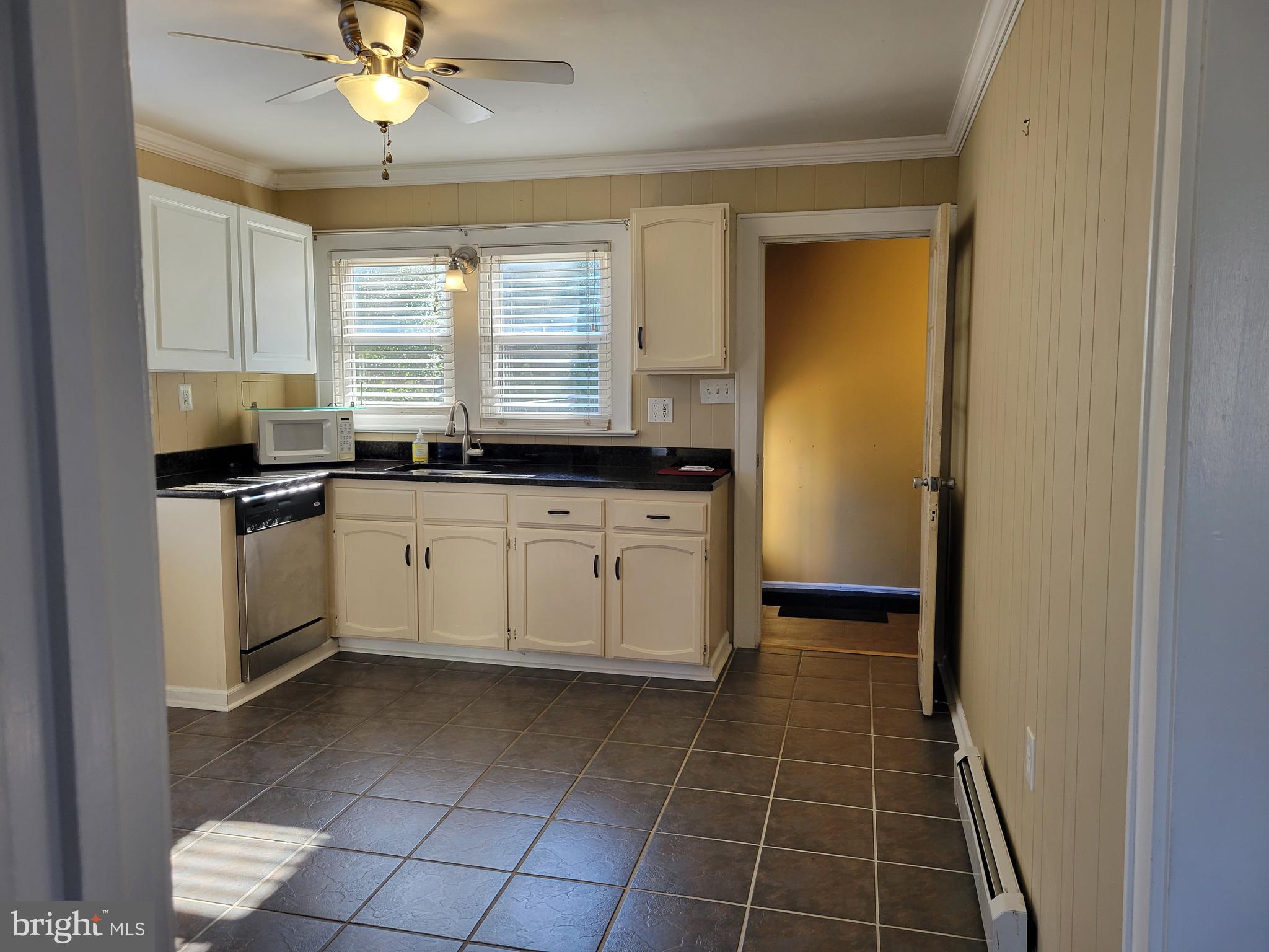 11 Zieglers Lane Hamilton, NJ 08690 - Photo 5 of 20 a white kitchen with a sink a counter space cabinets and appliances