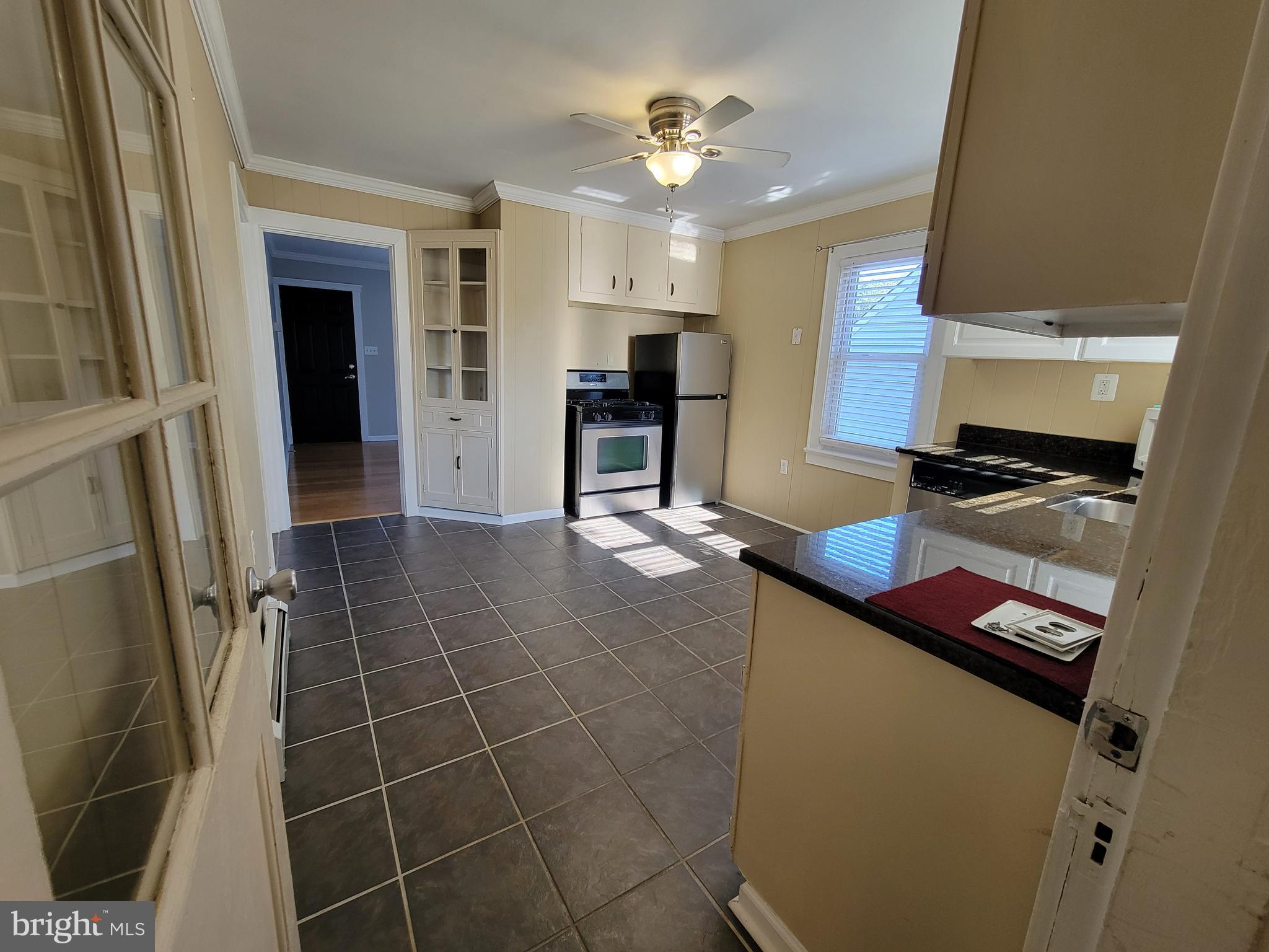 11 Zieglers Lane Hamilton, NJ 08690 - Photo 7 of 20 a kitchen with stainless steel appliances granite countertop a sink and a stove top oven