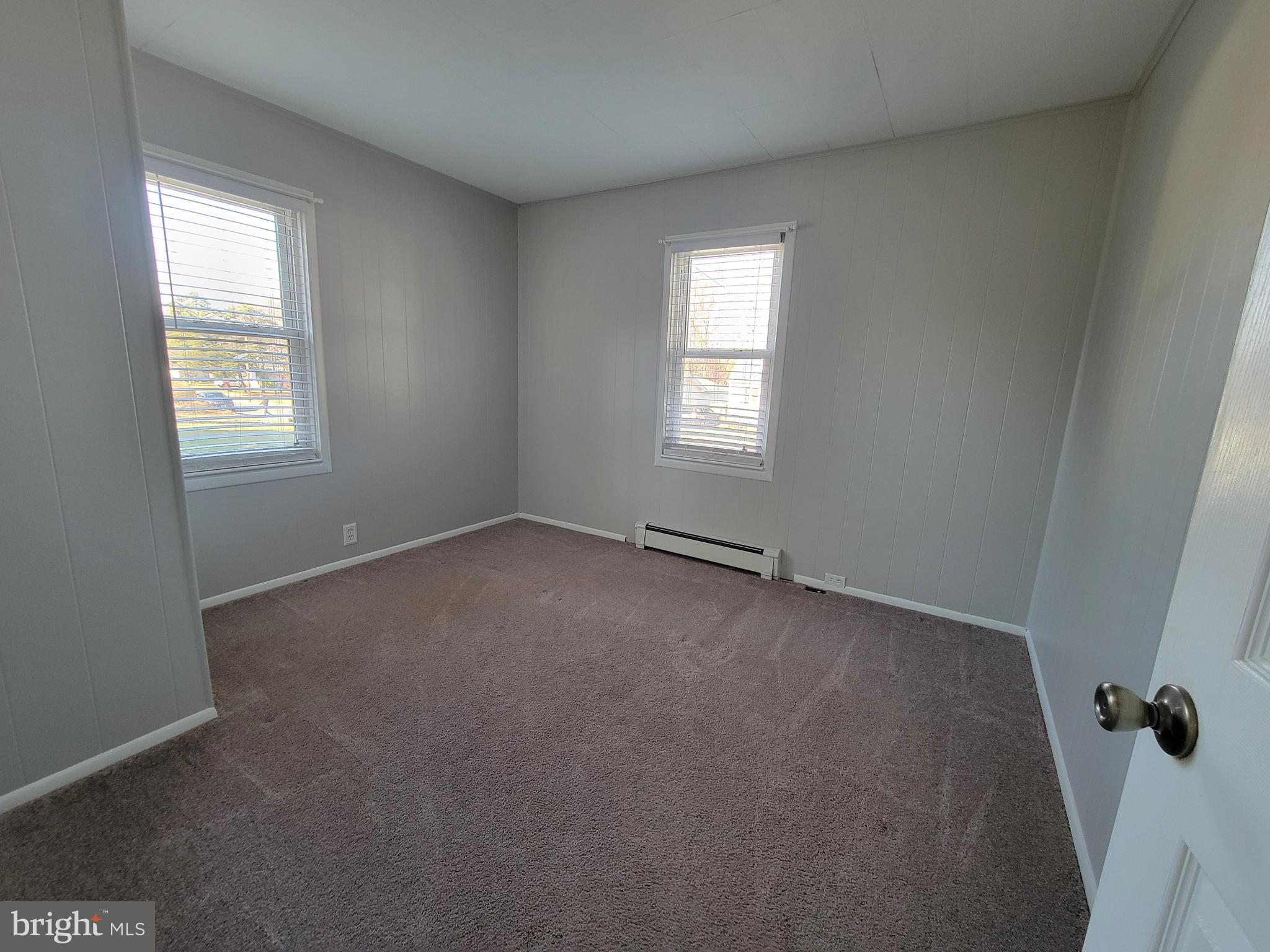 11 Zieglers Lane Hamilton, NJ 08690 - Photo 10 of 20 a view of an empty room with a window