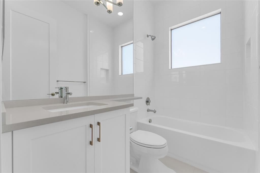 20041 Pacific Dunes Drive Boca Raton, FL 33434 - Photo 23 of 64 a bathroom with a granite countertop sink a toilet and shower