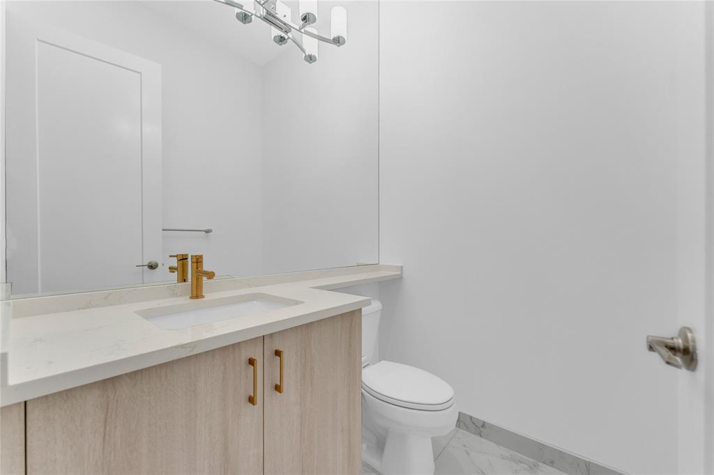 20041 Pacific Dunes Drive Boca Raton, FL 33434 - Photo 24 of 64 a bathroom with a sink a toilet and a mirror