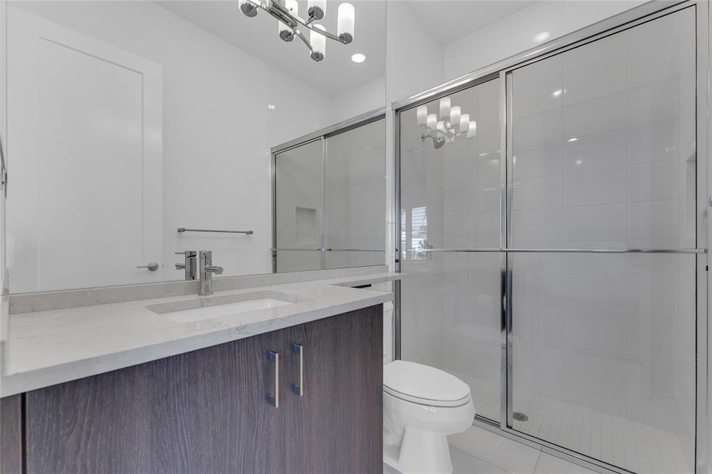 20041 Pacific Dunes Drive Boca Raton, FL 33434 - Photo 25 of 64 a bathroom with a sink a toilet and shower