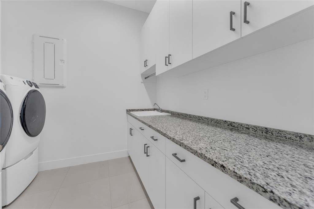 20041 Pacific Dunes Drive Boca Raton, FL 33434 - Photo 26 of 64 a bathroom with a granite countertop sink and a vanity
