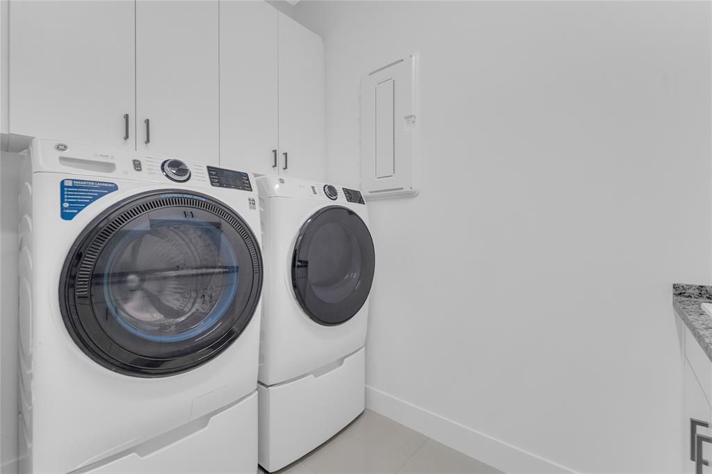 20041 Pacific Dunes Drive Boca Raton, FL 33434 - Photo 27 of 64 a utility room with dryer and washer