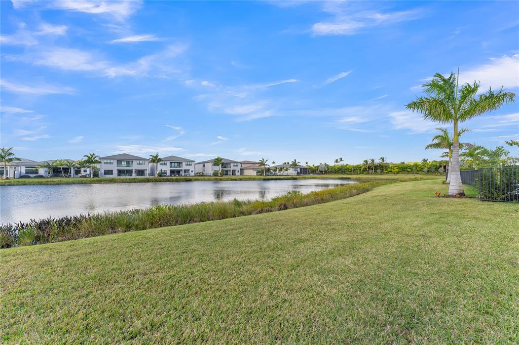 20041 Pacific Dunes Drive Boca Raton, FL 33434 - Photo 33 of 64 a view of a lake with houses in the background