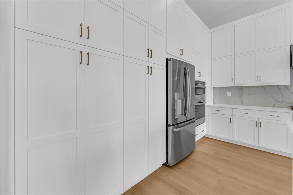 20041 Pacific Dunes Drive Boca Raton, FL 33434 - Photo 7 of 64 a kitchen with stainless steel appliances a refrigerator and cabinets