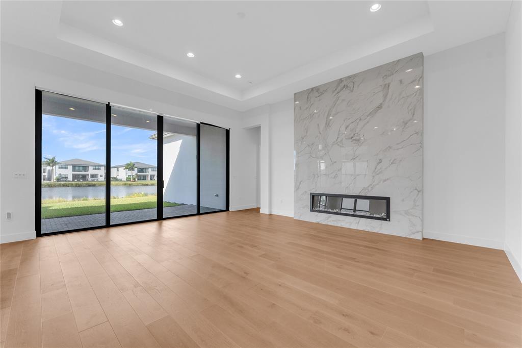 20041 Pacific Dunes Drive Boca Raton, FL 33434 - Photo 10 of 64 a view of an empty room with a sliding door