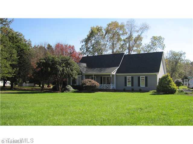 8021 Linville Road Oak Ridge, NC 27310 - Photo 1 of 16 Exterior Front. Cap Cod located on large level lot in Oak Ridge
