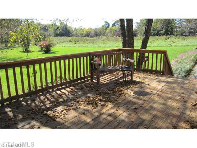 8021 Linville Road Oak Ridge, NC 27310 - Photo 14 of 16 Patio/Deck. Over sized deck area for entertaining friends and family
